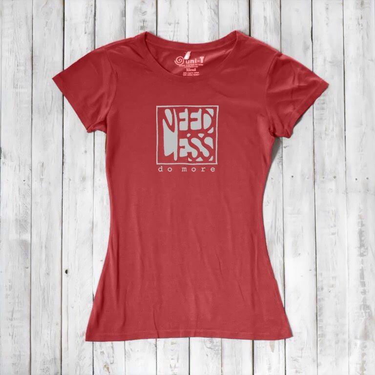 Coral red women's motivational t-shirt in bamboo and organic cotton. 'Need Less Do More' quote tee for eco-conscious minimalist wardrobe.