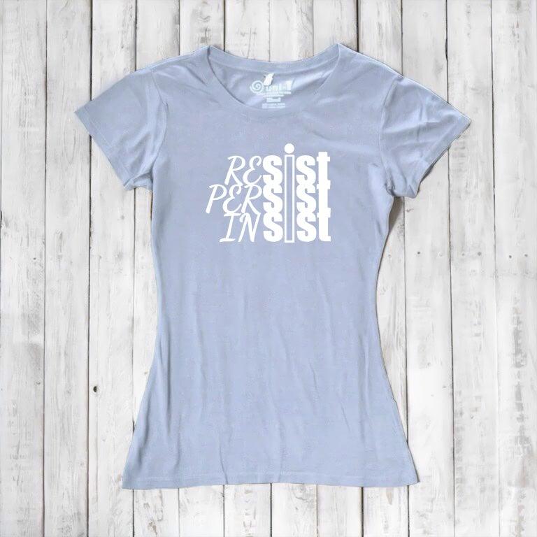 Light blue women's t-shirt with white 'Resist Persist Insist' text. Sustainable bamboo & organic cotton activist tee by Uni-T.