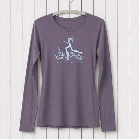 Run More Long Sleeve T-Shirt Women in dark purple with cityscape and runner graphic. Bamboo organic cotton activewear for running and fitness.