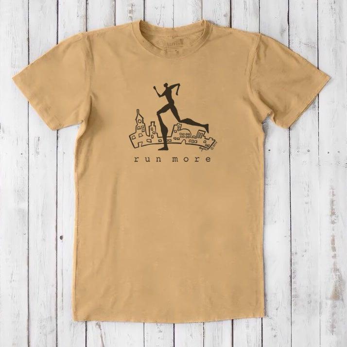 Tan 'Run More' men's eco-conscious T-shirt in bamboo and organic cotton, featuring a black runner graphic over a cityscape.