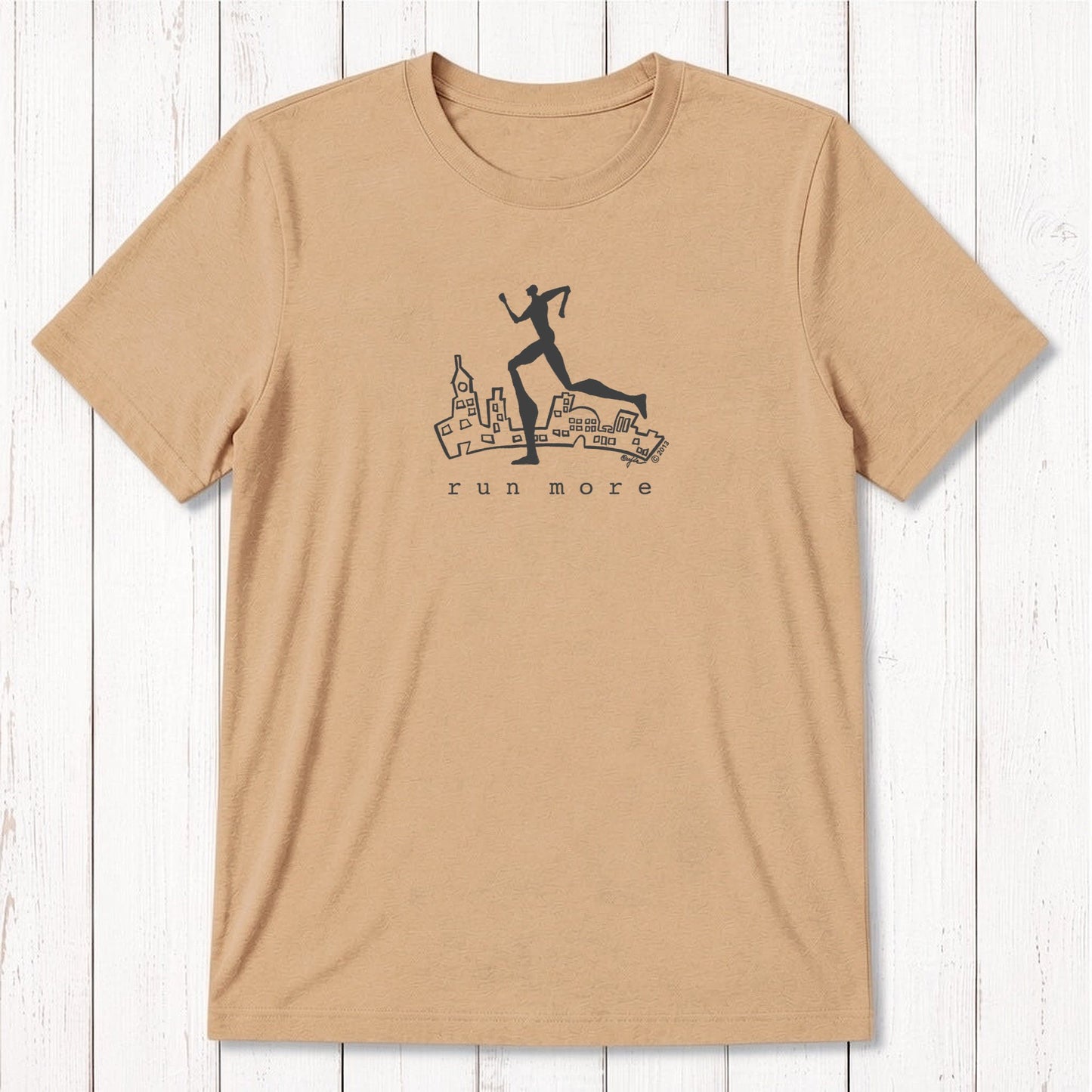 Tan 'Run More' men's eco-conscious T-shirt in bamboo and organic cotton, featuring a black runner graphic over a cityscape.