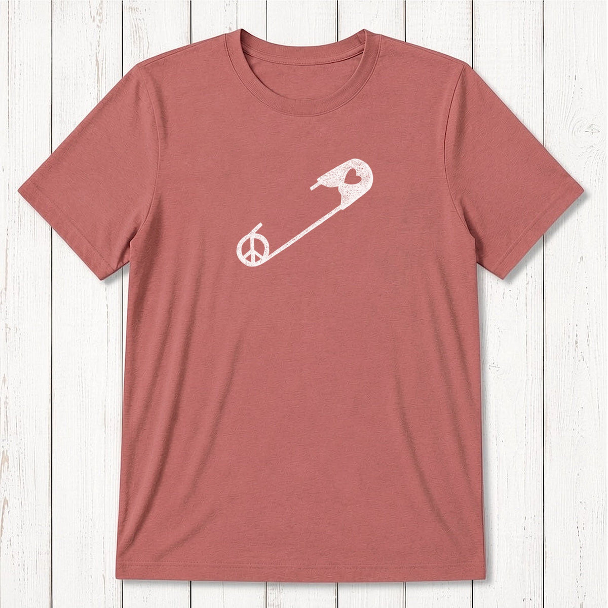 Red clay men's bamboo & organic cotton t-shirt with white safety pin and peace sign. Sustainable graphic tee for allyship and human rights.
