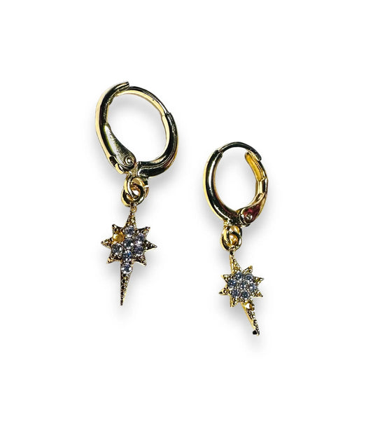 Gold Star Huggie Hoops Earrings with sparkling cubic zirconia stars, perfect for celestial jewelry lovers seeking elegant accessories.