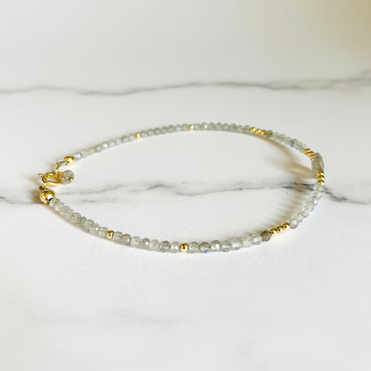 Delicate 7.5” Moonstone Sparkle Bracelet featuring faceted moonstone beads and gold accents. Lightweight and stylish for layering or solo wear.