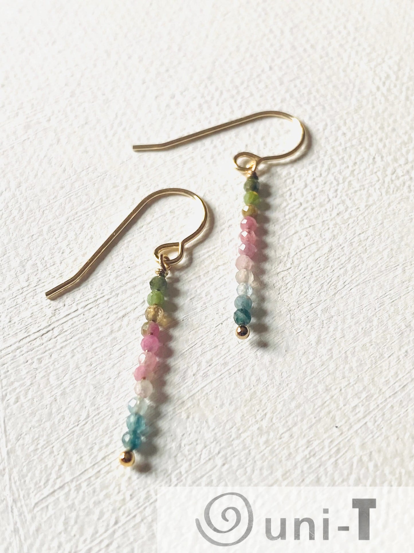 Delicate Glitter Stixx Earrings with genuine Watermelon Tourmaline beads and silver bar design, perfect for adding a pop of color to any outfit.