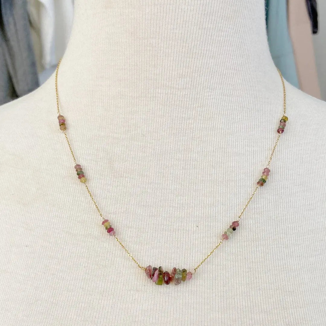 Floating Watermelon Tourmaline Necklace worn on a mannequin, highlighting its elegant pink and green gemstone design on a gold-filled chain.
