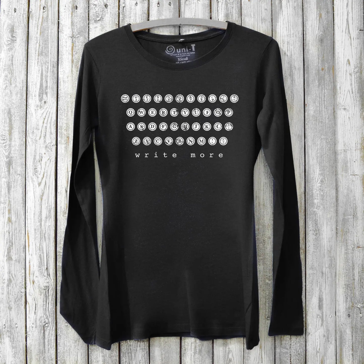 Black Women's Typewriter Long Sleeve T-Shirt in bamboo and organic cotton with white 'Write More' typewriter key print. Inspirational gift for creatives.