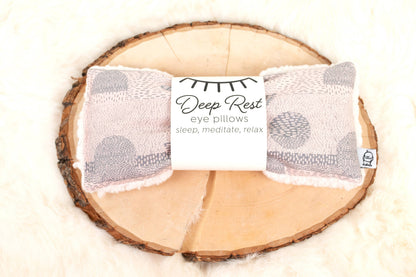 Weighted Eye Pillow for Relaxation | Stress Relief Aid on wood and fur background, labeled 'Deep Rest' for sleep, meditation, and stress relief.