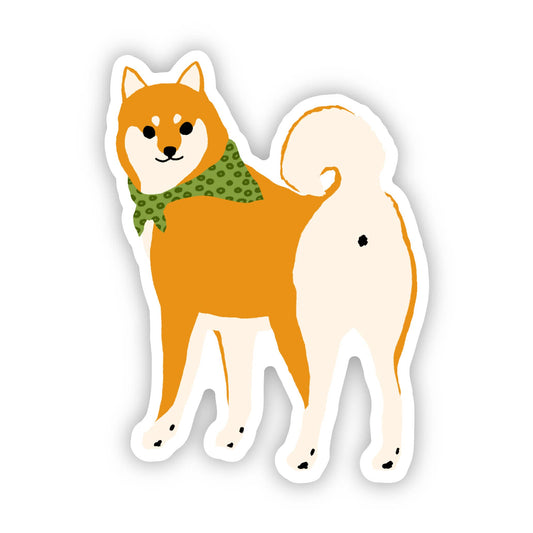 Shiba Inu vinyl sticker featuring a cute dog with a green polka dot scarf, waterproof and scratch-resistant for laptops or bottles.