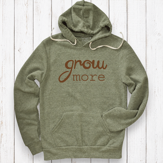 Heather olive hoodie on white wood.png