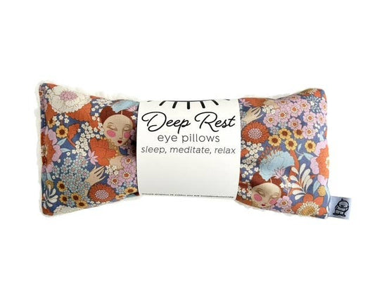 Deep Rest eye pillow with floral pattern and face illustration