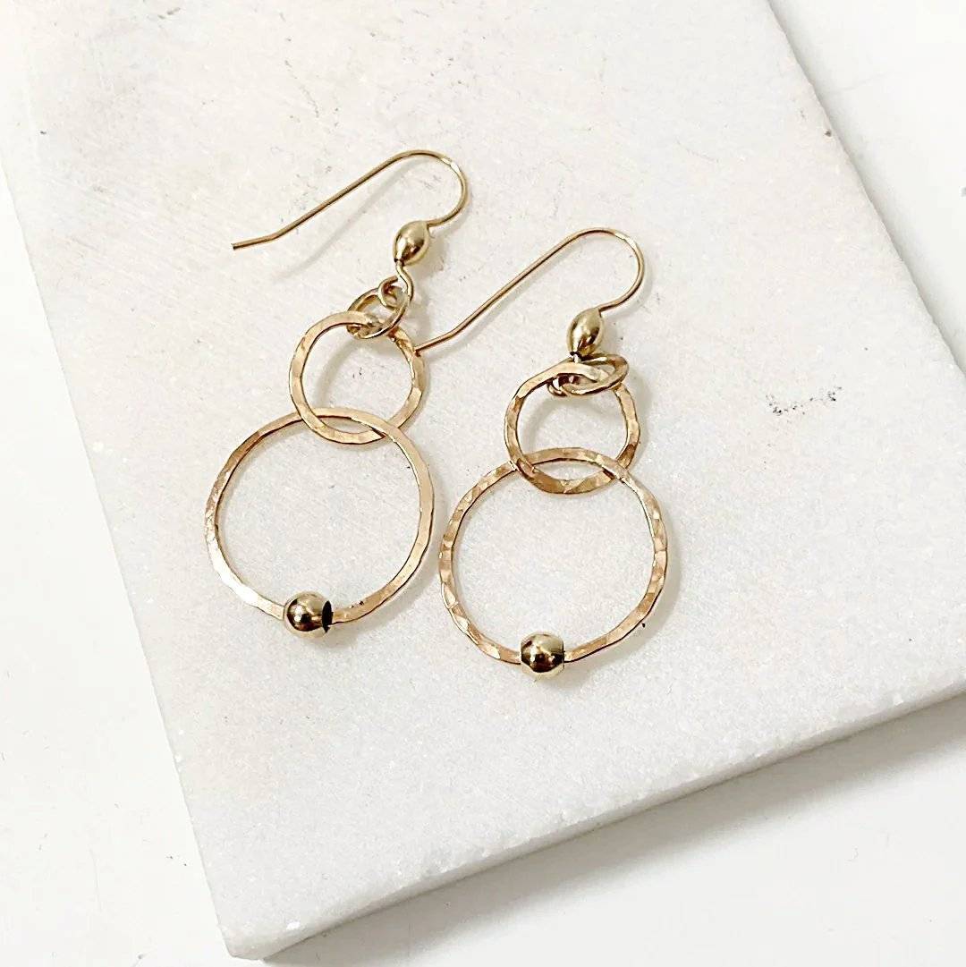 Close-up of gold HoopLink Earrings featuring durable soldered links and hammered finish, ideal for versatile jewelry styling.
