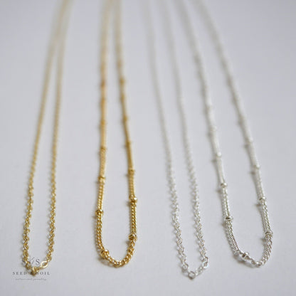 Assorted gold and silver chain options for the Valentine Round Rose Necklace, including 26 and 30 inch hypoallergenic styles.