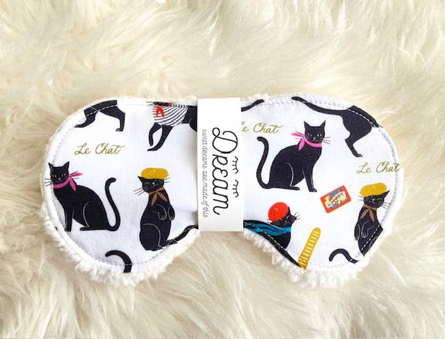 Cotton Sleep Mask for relaxation featuring black cats in berets on white fabric, backed with plush Sherpa for comfort and hand washable.