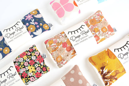 Assorted Liberty Eye Pillows in various colorful patterns, offering weighted stress relief and relaxation for sleep and mindfulness practices.
