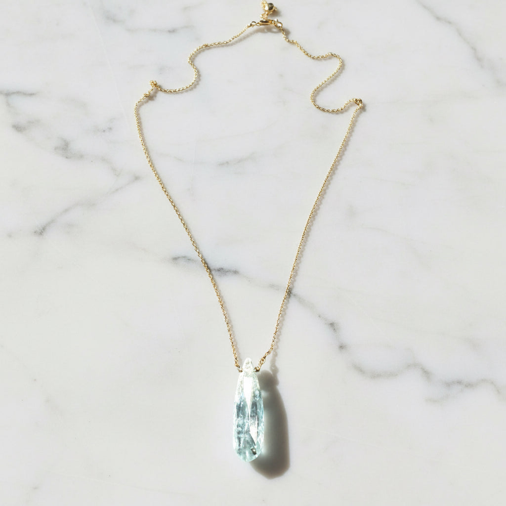 Gold chain necklace with aquamarine pendant