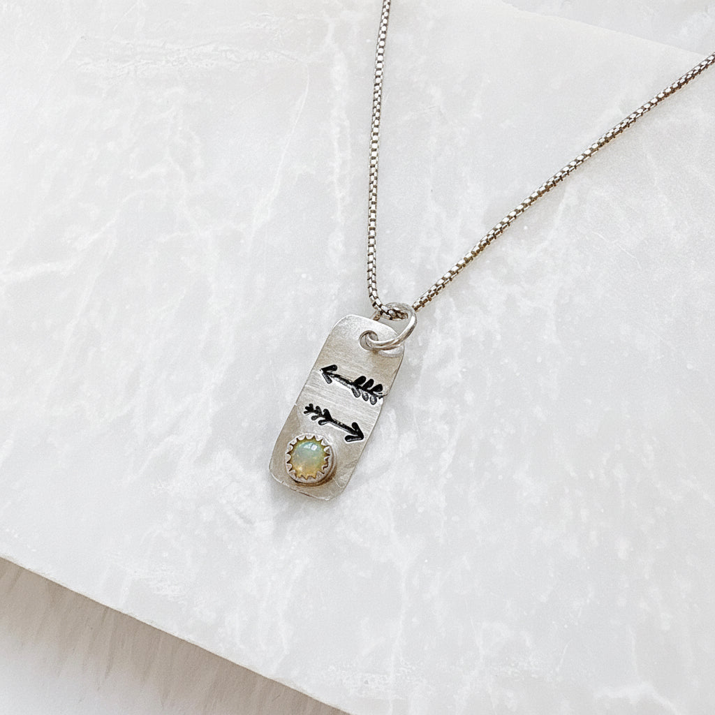 Opal Arrow Tag Necklace with engraved arrows and opal gemstone