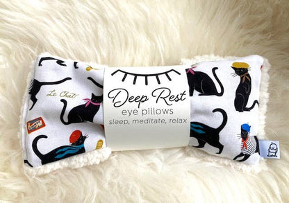 Deep Rest Eye Pillow featuring black cat illustrations on a white background, perfect for meditation, tension relief, and self-care routines.