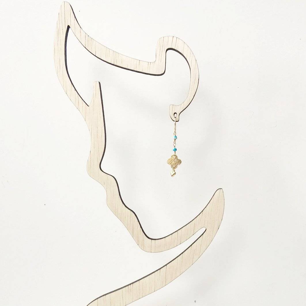 Turquoise chain earrings displayed on a minimalist earring stand, showcasing their lightweight and dainty design for everyday wear.