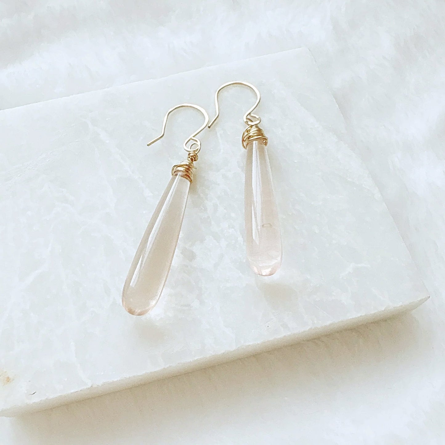 Elegant pink gemstone teardrop earrings with gold wire wrapping