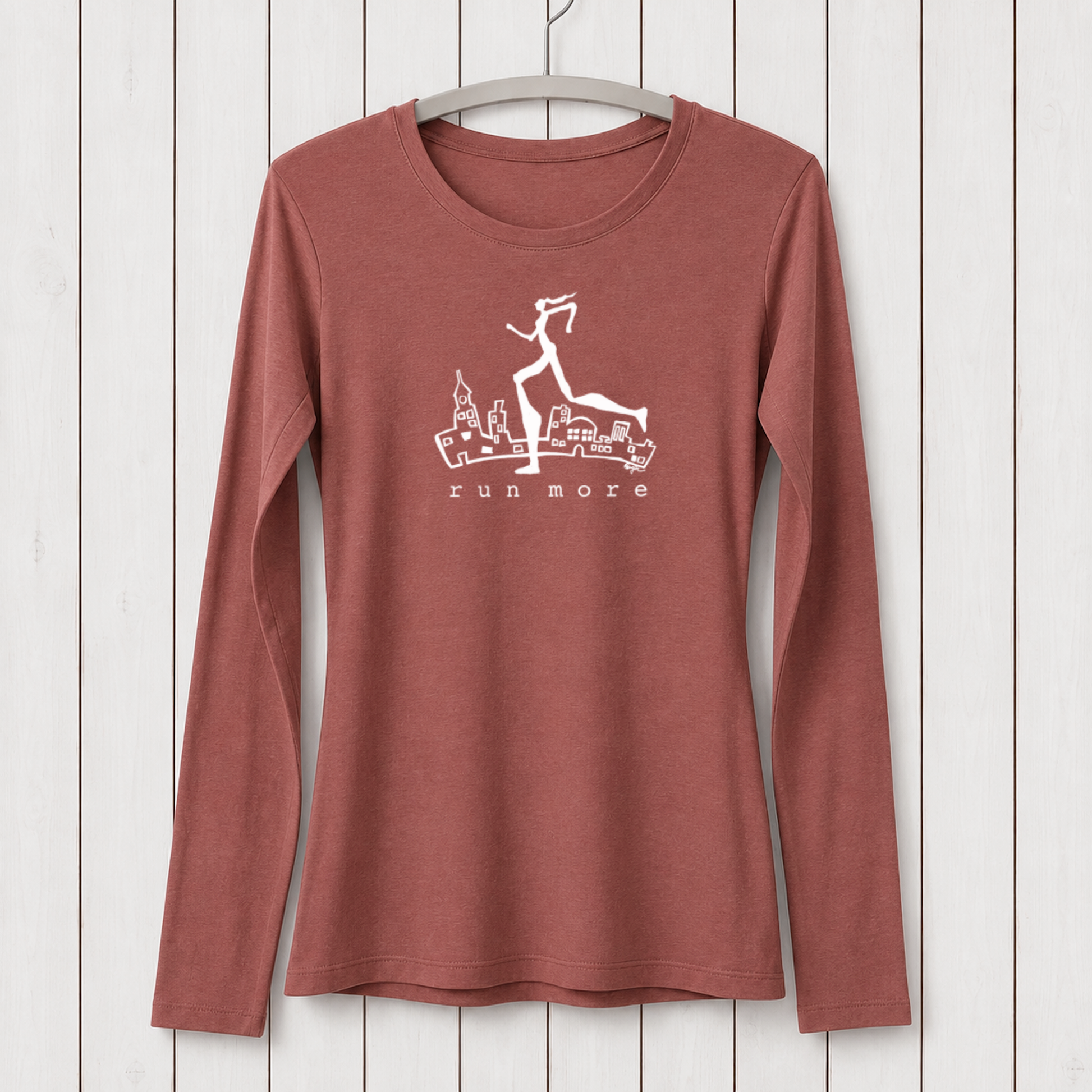 Rust-colored women's long sleeve T-shirt made from bamboo organic cotton with a graphic of a running woman over cityscape, perfect for active lifestyles.