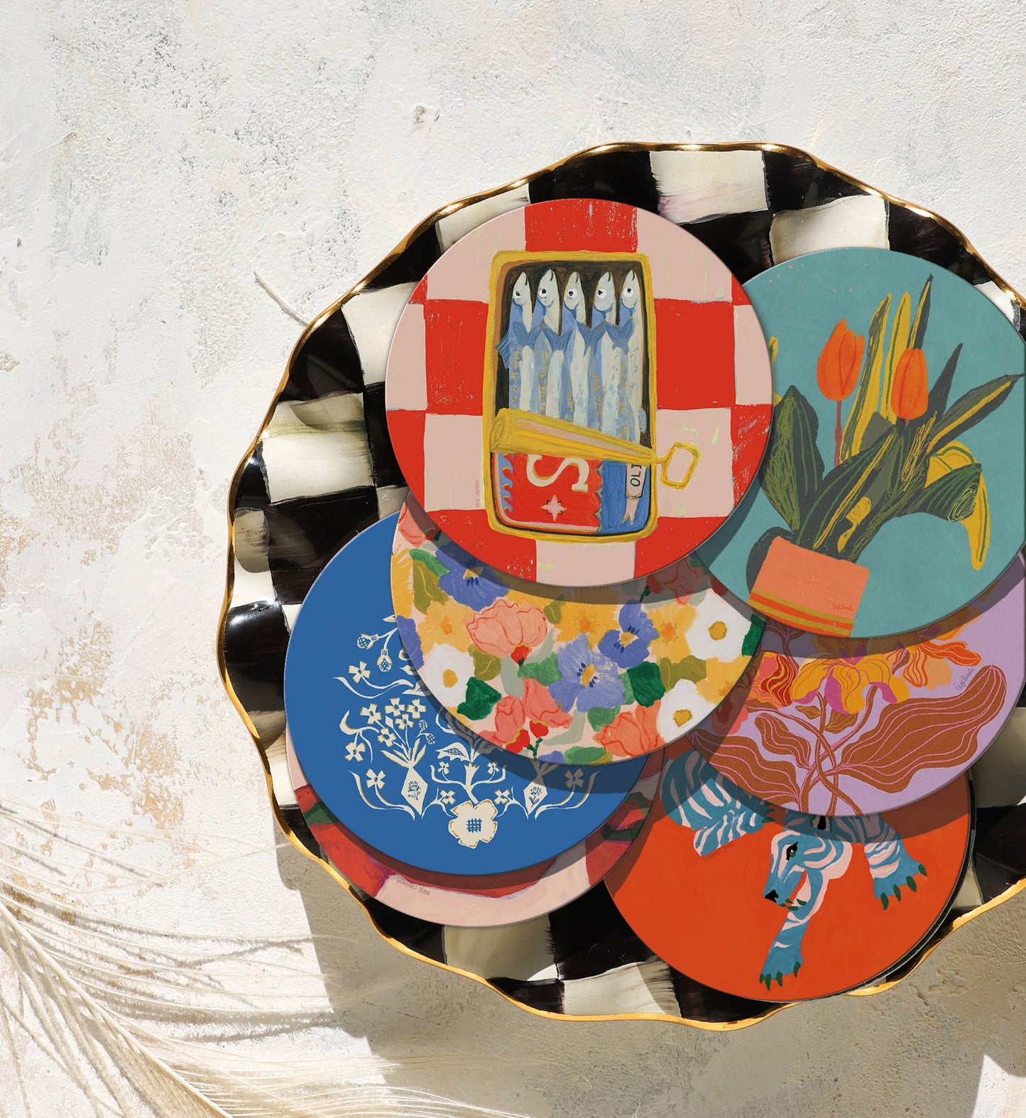 Sardines Seedlings Coaster displayed among other colorful coasters on a decorative plate, perfect for gifting or entertaining.