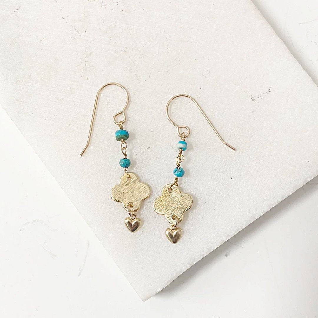Turquoise chain earrings with brushed brass quatrefoil charms and gold heart drops, featuring dainty turquoise beads and gold-filled ear wires.