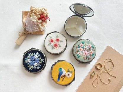 Floral Embroidered Jewelry Box - Round & Mirror | 3 Compartments in assorted designs with dried flower bouquet, ideal for gifting and jewelry storage.