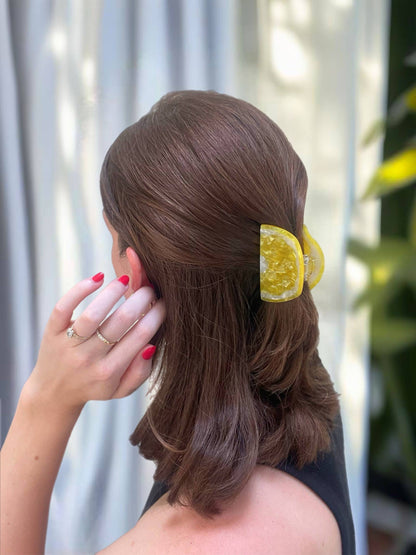 Sunshine Yellow Lemon Claw Hair Clip securing half-up hairstyle, blending fashion and function for everyday summer wear.