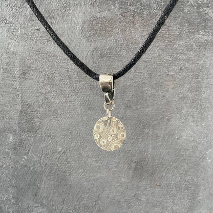 Sterling Silver Dandelion Medallion Necklace by Uni-T displayed on textured background, highlighting detailed floral engraving and minimalist charm.