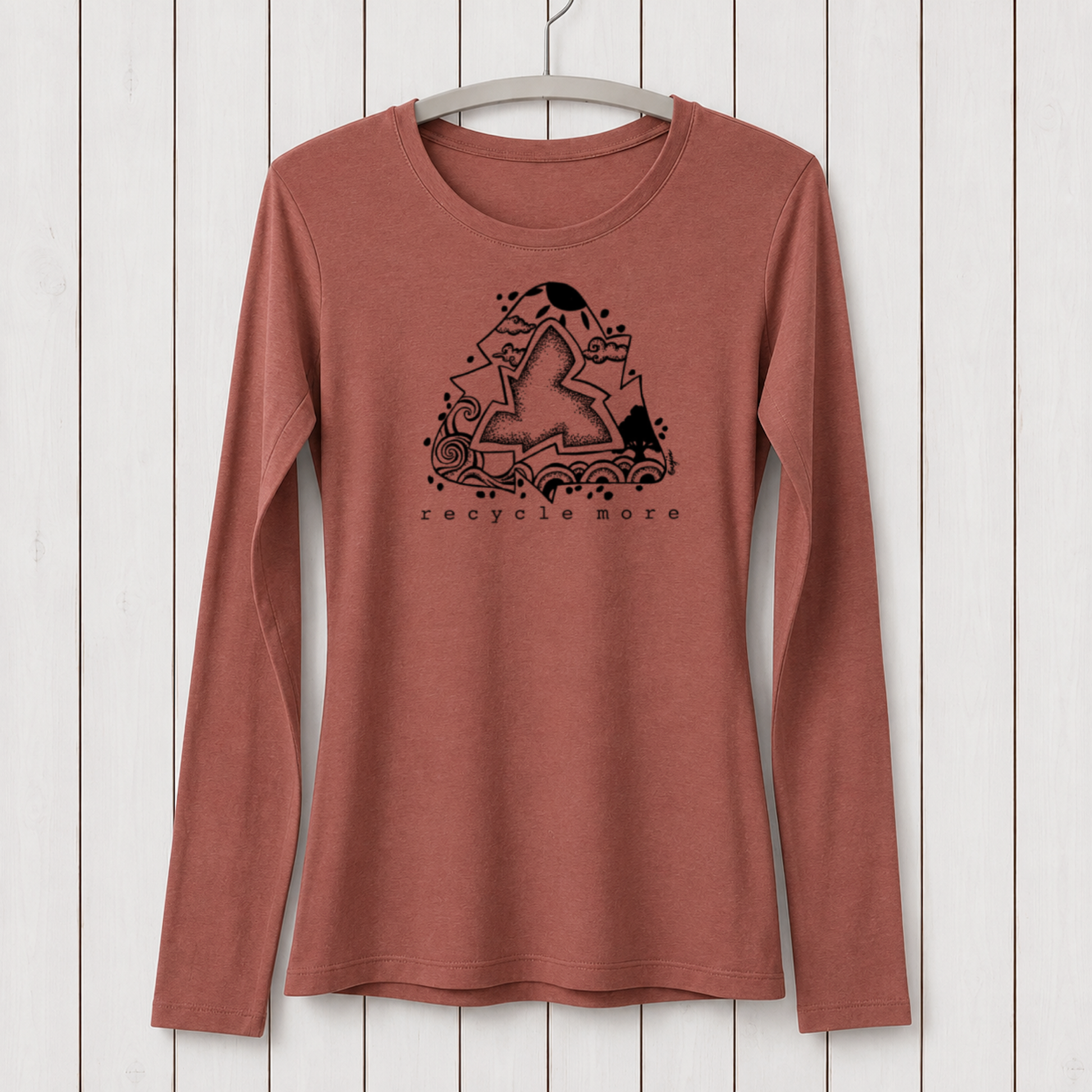 Long sleeve women's T-shirt in earthy terracotta color with black graphic design of a star, waves, and nature elements, featuring 'recycle more' text, made from sustainable bamboo and organic cotton fabric.