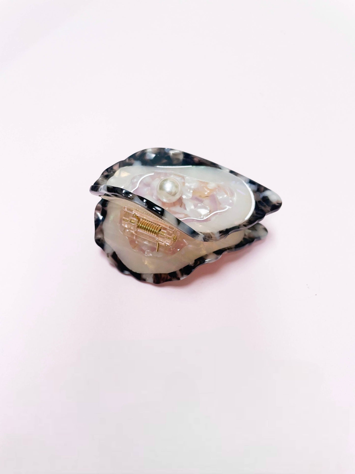 Side view of Line&Co Oyster Claw Clip with Pearl showing clasp and shell design. Functional and fashionable hair accessory.