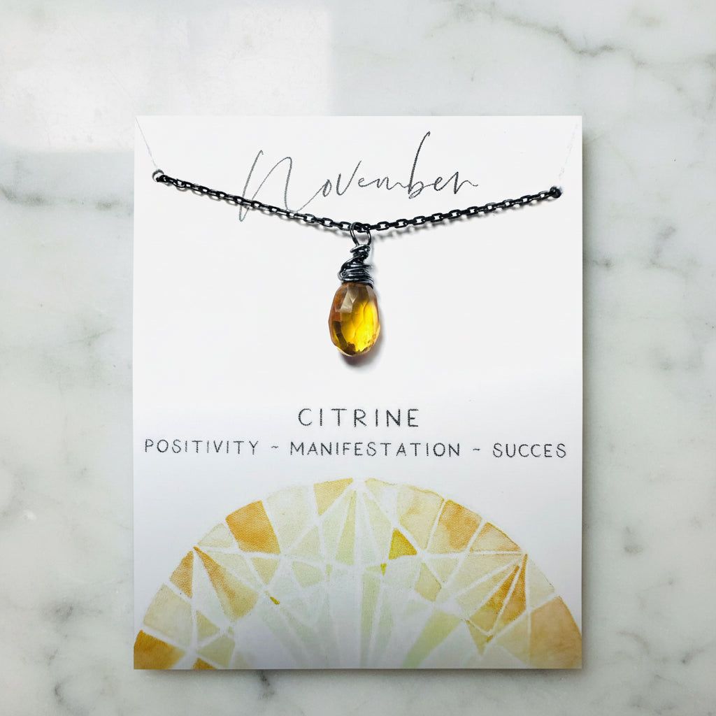 Citrine gemstone necklace on card