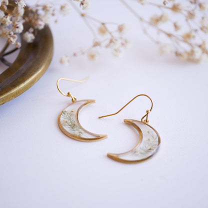 Brass Garden Flower Earrings with real Queen Annes Lace flowers. Crescent moon design with floral inlay, perfect for nature-themed accessories.