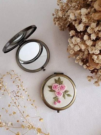 Compact mirror from Sophia Collection with pink rose embroidery on cream linen, elegant and practical gift for mom or wife.