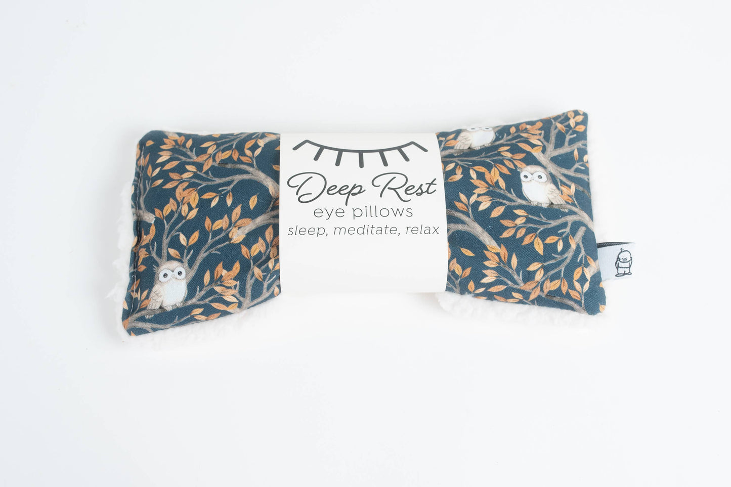 Weighted eye pillow for relaxation with owl print packaging labeled 'Deep Rest', perfect for stress relief and meditation routines.