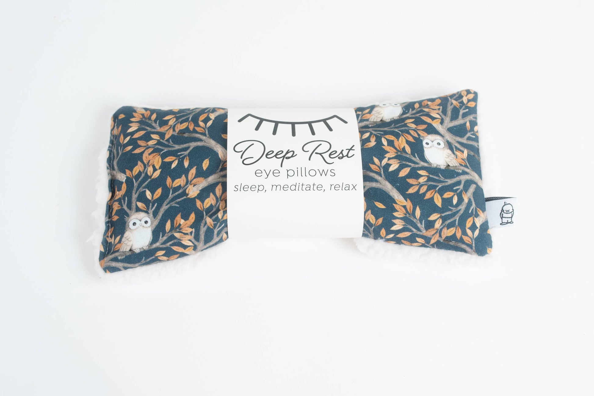 Weighted eye pillow for relaxation with owl print packaging labeled 'Deep Rest', perfect for stress relief and meditation routines.