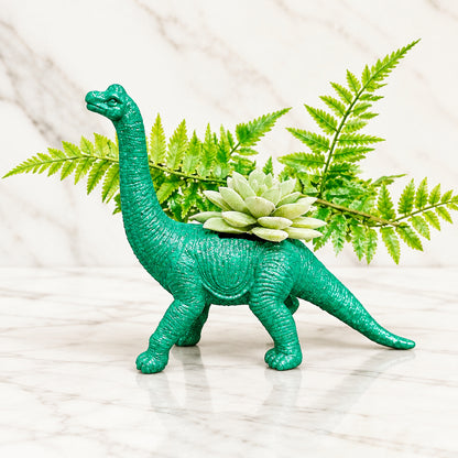 66a52de5c47c9c3ce95361c2_glittery-green-apatosaurus-dinosaur-planter-side_1790451448885.jpg