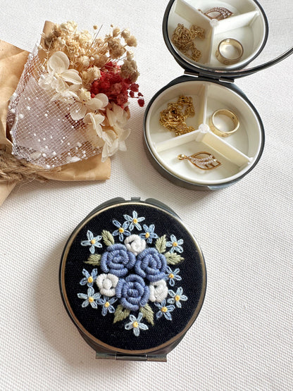Blue rose-themed Floral Embroidered Jewelry Box with mirror and 3 compartments, perfect for elegant jewelry storage and care.