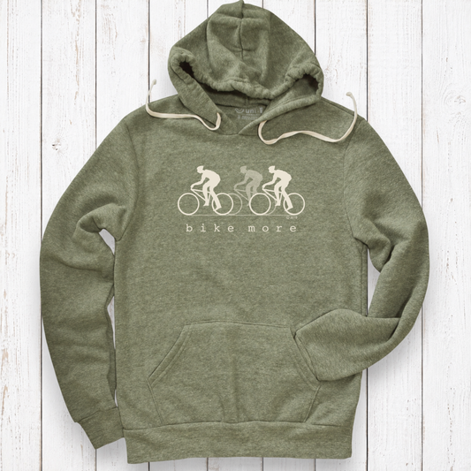 Heather olive hoodie on white wood.png