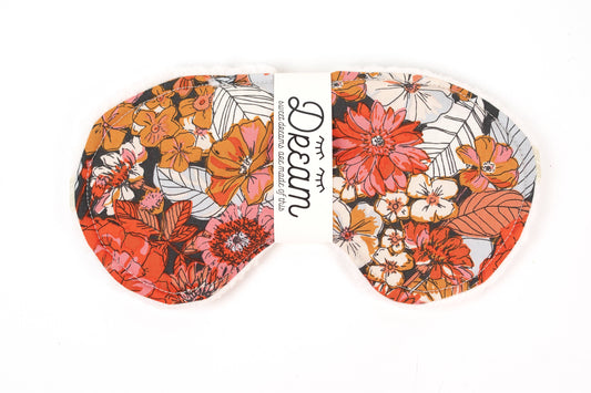 Close-up of Sweet Dreams Sleep Mask - Little Man featuring vibrant orange and red floral cotton fabric for stylish and comfortable sleep.