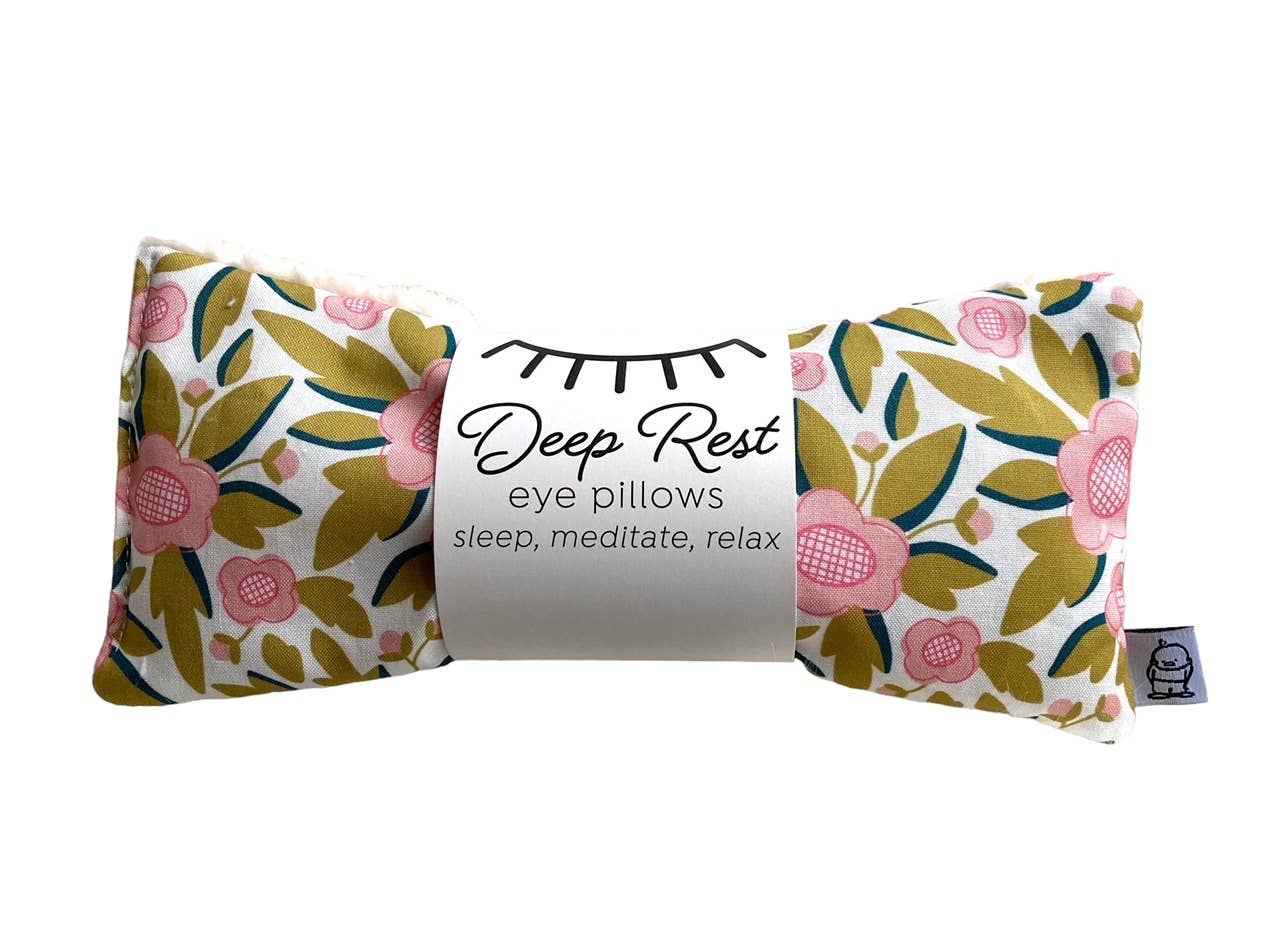 Deep Rest weighted eye pillow in floral design, promoting deep rest and acupressure benefits for sleep and relaxation.