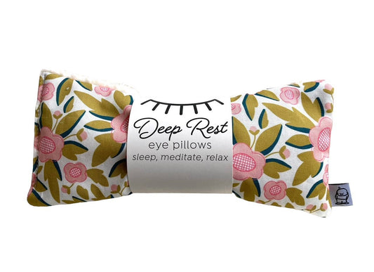 Deep Rest weighted eye pillow in floral design, promoting deep rest and acupressure benefits for sleep and relaxation.