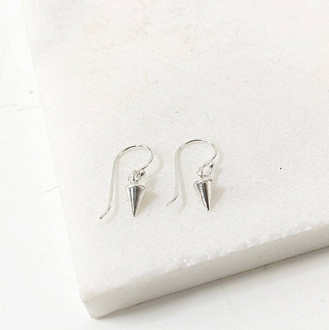 Close-up of Tiny Spike Earrings-Uni-T - Sterling Silver with polished spike pendants, ideal for a playful and edgy accessory look.