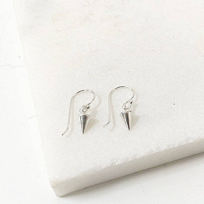 Close-up of Tiny Spike Earrings-Uni-T - Sterling Silver with polished spike pendants, ideal for a playful and edgy accessory look.