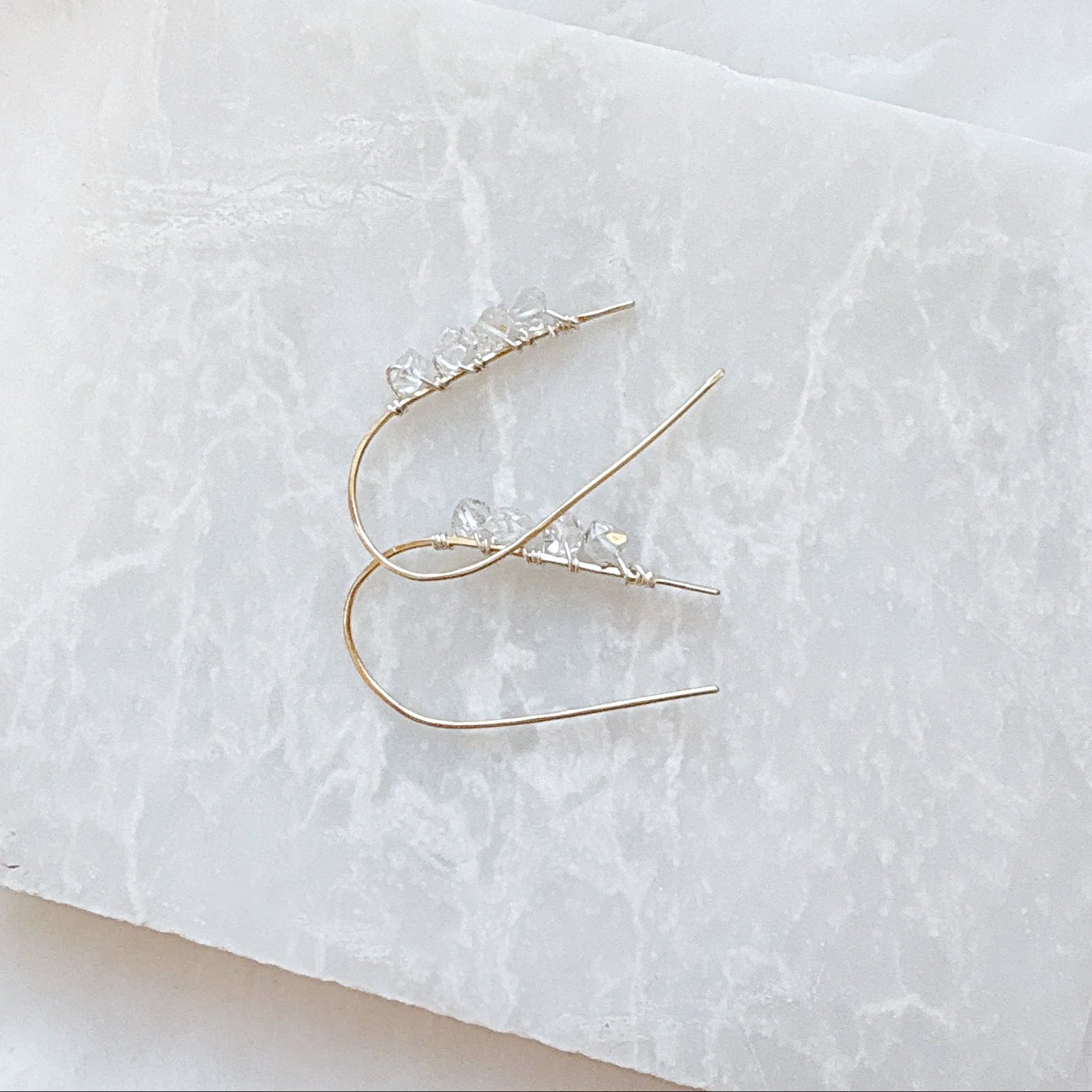 Close-up of Herkimer Diamond earrings with genuine beads and silver hooks