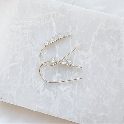 Close-up of Herkimer Diamond earrings with genuine beads and silver hooks