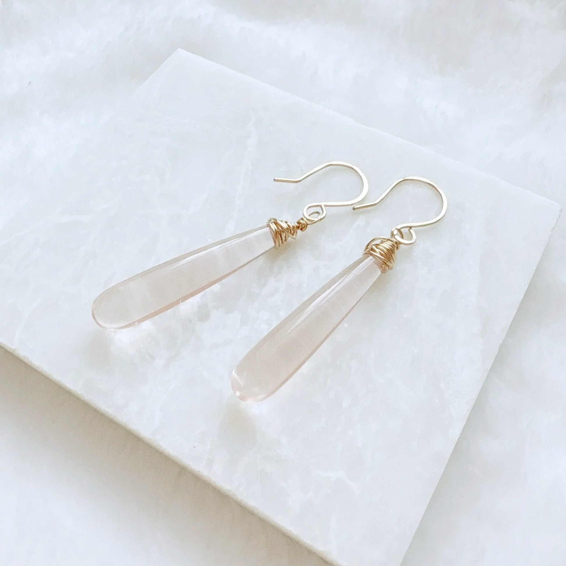Pink gemstone teardrop earrings with silver hooks