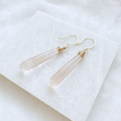 Pink gemstone teardrop earrings with silver hooks