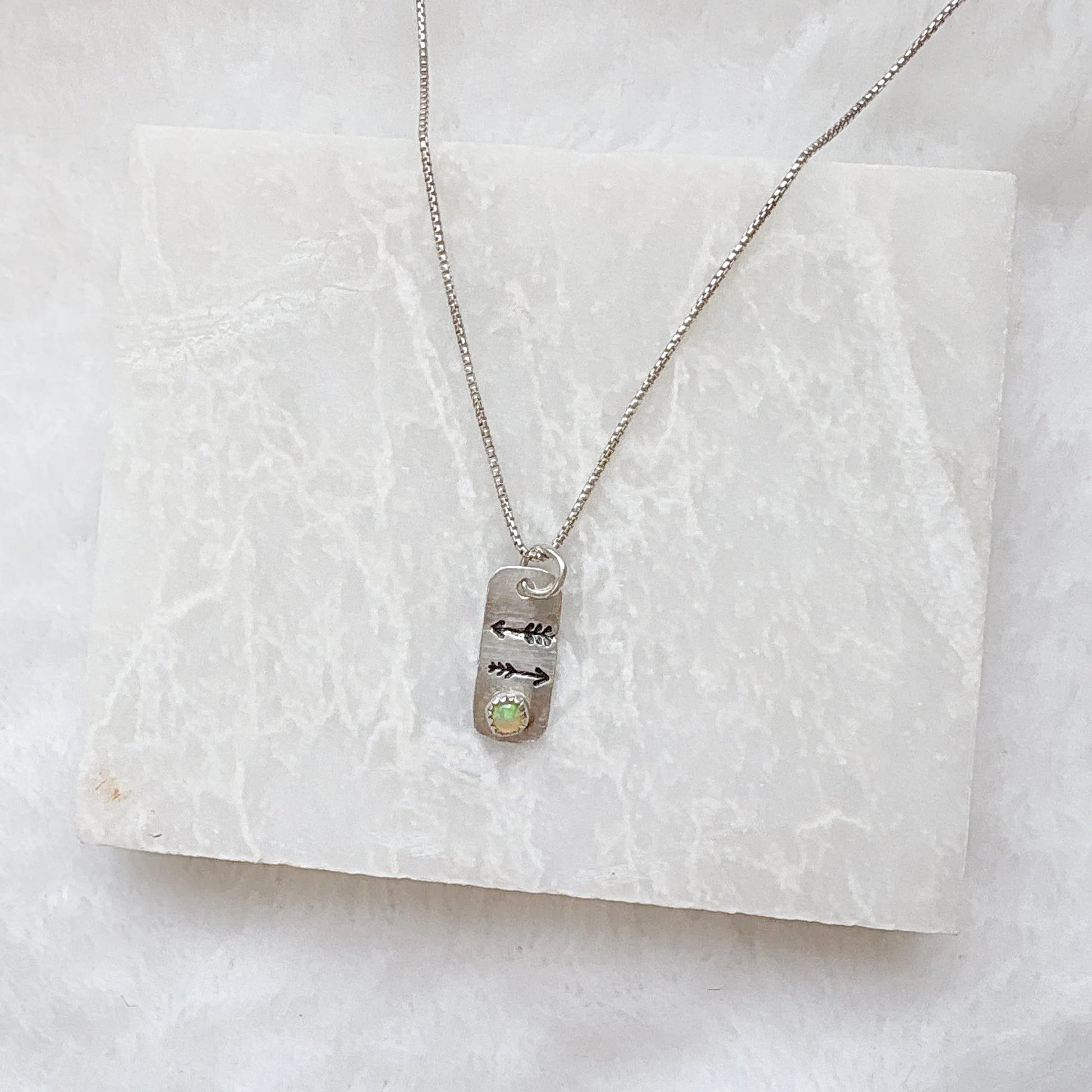 Opal Arrow Tag Necklace on chain with engraved arrows and gemstone